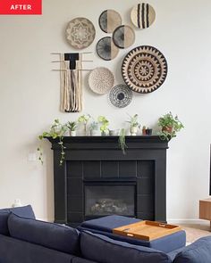 a living room filled with furniture and a fire place in front of a wall mounted art piece