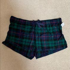 Old Navy Flannel Boxer Pajama Shorts. Green And Navy Plaid With Some Red. Elastic Waist With A Navy Ribbon Tie. Has About 1 Inch Slits On The Sides. Size Xxl. 100% Cotton. Green Pajama Shorts For Sleepover, Casual Green Sleep Shorts, Plaid Shorts For Loungewear, Green Pajama Shorts For Sleep, Casual Plaid Short Sleepwear, Plaid Short Bottoms For Pajama Party, Plaid Shorts For Pajama Party, Plaid Pajama Shorts For Loungewear, Navy Ribbon