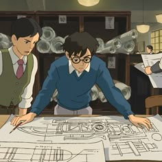 two men are looking at a blueprint on the table in front of some bottles