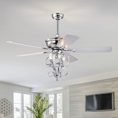 a ceiling fan with three lights in a room