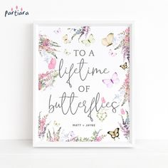 a white framed sign that says to a life time of butterflies