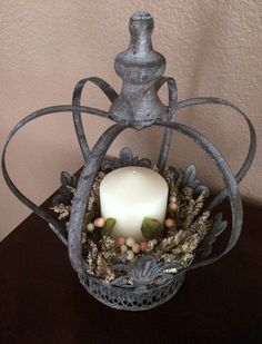 a candle is sitting in a decorative basket