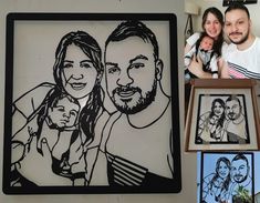 a man and woman holding a baby in front of a family portrait on a wall