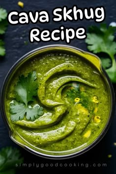 a bowl filled with green guacamole and topped with cilantro leaves