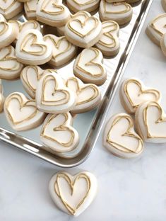 some heart shaped cookies are on a tray