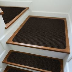 carpeted stair treads with wooden hand rails