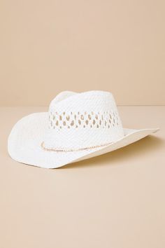 Giddy up and head to the shore with an on-trend look like the Lulus Cutest Cowgirl White Woven Western Hat! Woven straw shapes this cute beach-ready hat that is boasting with coastal western vibes with its curved brim and teardrop-shaped crown with a classic dipped effect and pierced details. An irridescent rhinestone-embellished band lends an eye-catching finish to this must-have accessory. 3. 25" Soft Brim. 22. 25" Interior Circumference With An Internal Drawstring. Crown Measures 4. 25" Tall. White Straw Hat Bands For Ranch, White Western Hat For Spring, White Western Straw Hat, White Straw Hat Bands For Country Events, White Country Style Fedora Straw Hat, Country Style White Straw Hat Bands, Western White Sun Hat For Vacation, White Western Panama Hat For Beach, Western Style White Sun Hat For Vacation