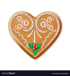 a ginger cookie in the shape of a heart with icing and holly berries on it