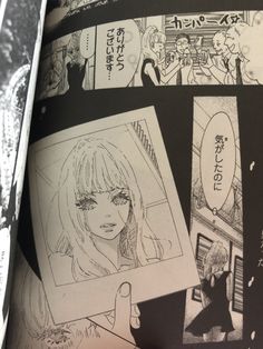 an open book with drawings and pictures on the pages, including a woman's face