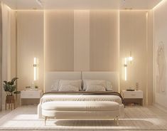 a large white bed sitting in a bedroom next to a wall mounted light above it