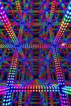 an image of colorful lights in the shape of a square pattern on a black background