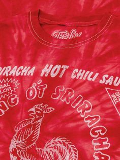 Your New Favorite Tee There's a pecking order when it comes to spicy sauces, but don't be fooled by the hype - only Huy Fong's Tuong Ot Sriracha sauce rules the roost! To help our fellow Sriracha-addicts show off their love for this awesome hot sauce, we've crafted this tasty foodie t-shirt featuring the Sriracha Hot Chili Sauce rooster logo. To complete the vintage look and feel of this Sriracha shirt - we've distressed the graphic to look like it's been in your closet pho-ever, and printed it Red Tops With Logo, Retro Red Graphic Print Shirt, Hot Sauce Design, Hot Sauce Shirt, 90s Red T-shirt With Text Print, Vintage Red Hot Chili Peppers Shirt, Pecking Order, Rooster Logo, Hot Chili Sauce