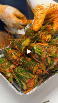 there is a tray full of cooked vegetables on the table with other dishes in the background