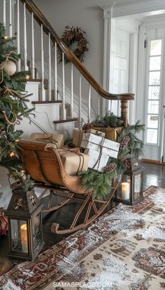 a sleigh filled with presents under a christmas tree in a home decorated for the holidays