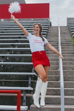 Details White baby tee Red lettering "Tailgate Cowgirl" on front Materials and Care 100% Cotton Wash cold Dry low heat Cheerleader Skirt, Cowgirl Baby, Cheerleading Outfits, Hilarious Photos, Denim Outerwear, Model Poses Photography, Skirt Belt, Poses Photography, Sweater Tank Top