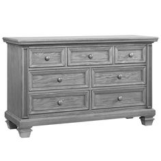 a gray dresser with six drawers