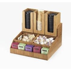 a wooden box filled with lots of different types of food and drinks on top of each other