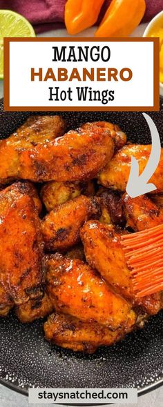 the recipe for mango habanero hot wings is shown on a plate with oranges and