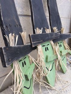 two wooden chairs with faces painted on them