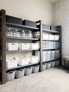 the shelves are filled with containers and bins for storing items or other things on them