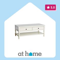 a white coffee table with two drawers on it and the words at home above it