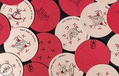 many red and white circular stickers with symbols on them