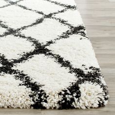 a black and white rug on the floor