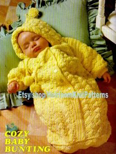 a baby is laying on the floor wearing a yellow outfit