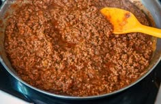 a pan filled with chili on top of a stove