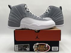 Elevate your sneaker game with these authentic Air Jordan 12 Stealth 2022 High Top sneakers. With a sleek gray and white colorway, these sneakers are perfect for any retro-themed outfit. The size 10.5 fit is designed for men and the athletic style is perfect for any physical activity. Crafted with the highest quality materials, these sneakers are built to last. The Jordan 12 Retro White silhouette is a classic look that will never go out of style. These sneakers are perfect for any collector or sneaker enthusiast. Get your hands on these rare retro sneakers today! 100% Authentic Need more pics just ask Any questions just ask New Size: 10.5 If the pictures show box, box is included 100% legit check feedback and other items Jordan 12 Stealth, Legit Check, Air Jordan 12, Air Jordan 12 Retro, Jordan 12 Retro, Jordan 12, Retro Tops, Jordans 12, Athletic Style