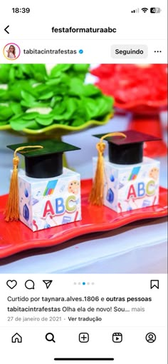 a red tray topped with graduation caps and tassels