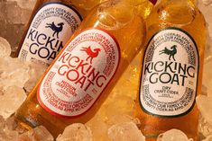 two bottles of kicking goat on top of ice