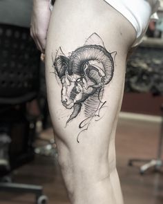 a woman's thigh with a ram tattoo on it