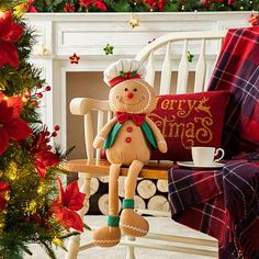 a stuffed toy sitting on top of a chair next to a christmas tree