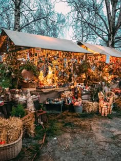 an outdoor market with lots of items on display