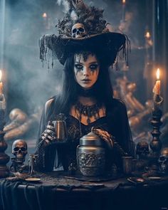 a woman dressed as a witch holding a teapot with candles in front of her