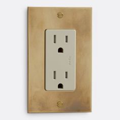 an electrical outlet with two outlets on the wall