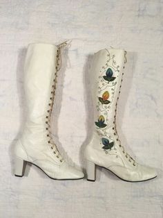 "1960s / early 70s GoGo boots white leather lace up embroidered floral detail w/tiny metal studs around the embroidery the flowers are embroidered patches and edges curl up a bit rubber heel and sole caps good vintage condition, light wear light scuffs, stains, age wear instep of right boot has a slight gap between sole and leather when worn the foot should secure this area w/it's weight could be taken to shop to secure *priced w/the possibility of that cost in mind label size 9 M, fit me true t Authentic 70s Fashion, White Gogo Boots, 70s Boots, 60s Women, Vintage Converse, Wedding Boots, Embroidered Boots, Boots White, Gogo Boots