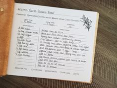 an open recipe book on a wooden table with writing in the pages and instructions for cooking