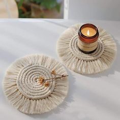 candle standing on round white drink coasters in makramee boho style with fringes as decoration on a white table Bohemia Style, Table Flag, Cabinet Kitchen, Macrame Boho, Candle Mat, Bohemian Handmade, 3d Embroidery, Camping Party, Boho Macrame