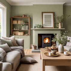 a living room filled with furniture and a fire place in the middle of the room