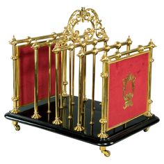 a gold and black display case with two red flags on it's sides, in front of a white background