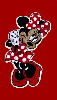 a mickey mouse patch with polka dots on it