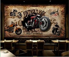 a motorcycle mural on the wall in a restaurant