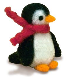 a stuffed penguin with a red scarf around its neck