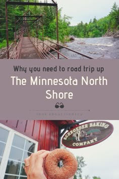 a person holding up a donut with the words minnesota north shore on it in front of