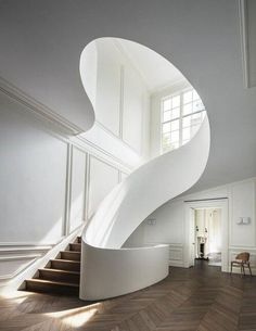 an image of a white staircase in the middle of a room