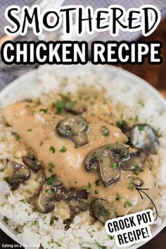 a white plate topped with rice covered in mushroom gravy next to a fork