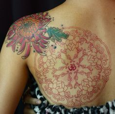 a woman with a tattoo on her back