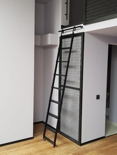 the ladder is leaning against the wall in the room